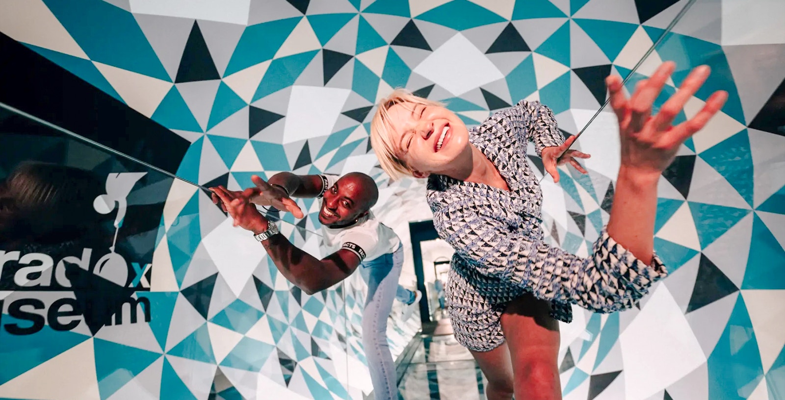 Visitors exploring optical illusions at Paradox Museum, France.