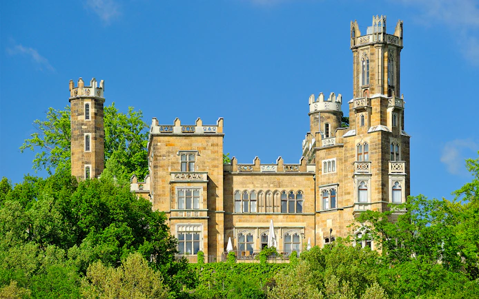 Schloss Eckberg castle surrounded by lush greenery in Dresden, Germany.