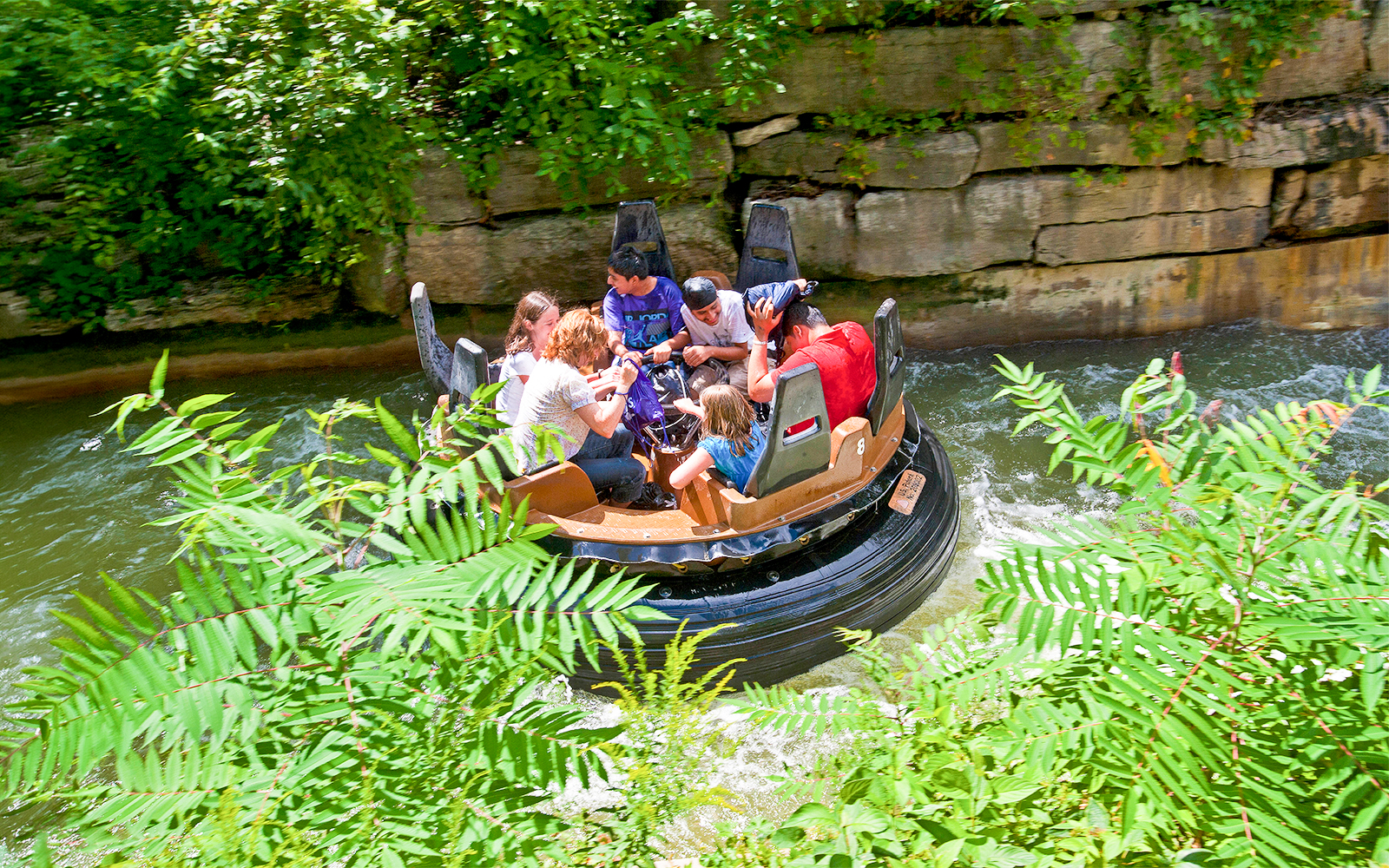 Rafting ride at White Water Canyon, Canada's Wonderland, surrounded by lush greenery.