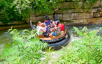 Rafting ride at White Water Canyon, Canada's Wonderland, surrounded by lush greenery.