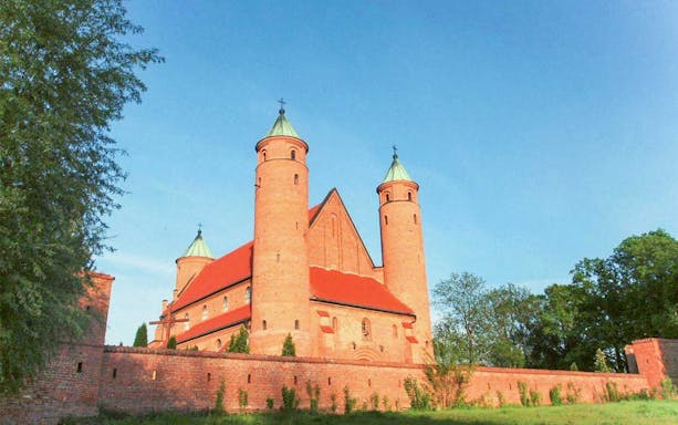 Brick castle with towers in Masovian countryside, Poland, on Chopin day tour from Warsaw.