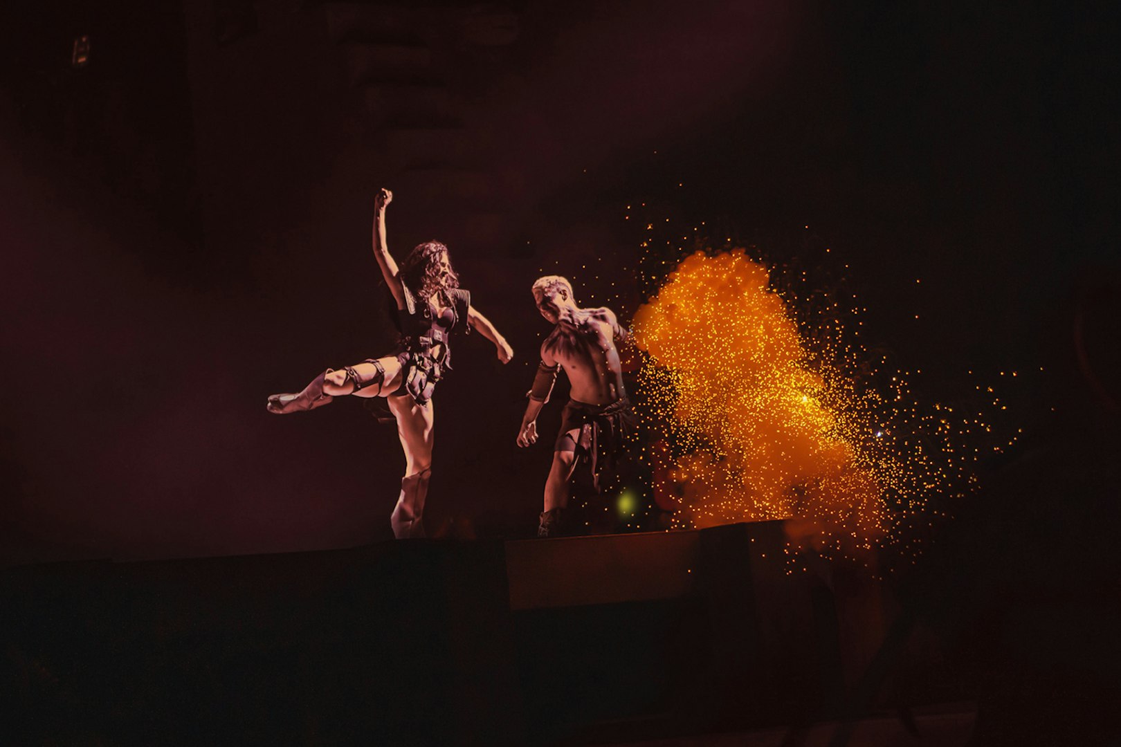 Performers on stage with fiery effects in MALINCHE, un musical de Nacho Cano.