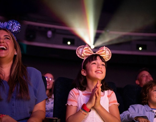 People watching movie screenings on a Disney Adventure Cruise