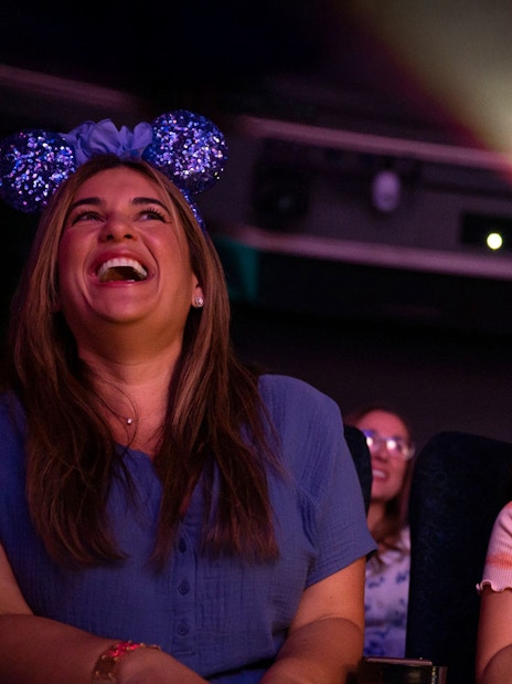 People enjoying a movie screening on Disney Adventure Cruise.