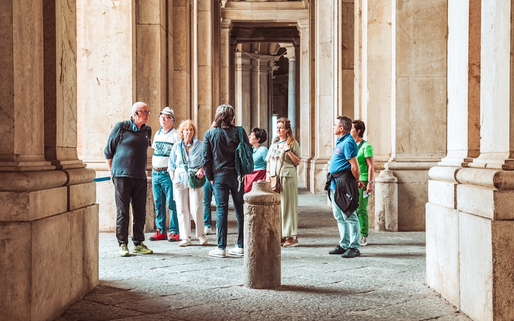 Participants on a guided tour inside the Royal Palace of Caserta, Italy.