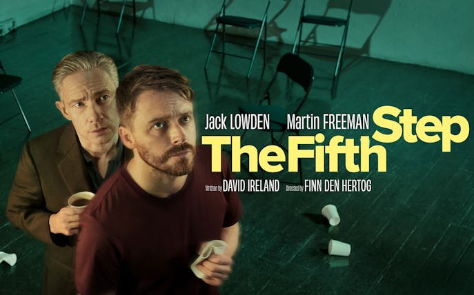 Two men holding cups in a dimly lit room with scattered chairs, promoting "The Fifth Step.