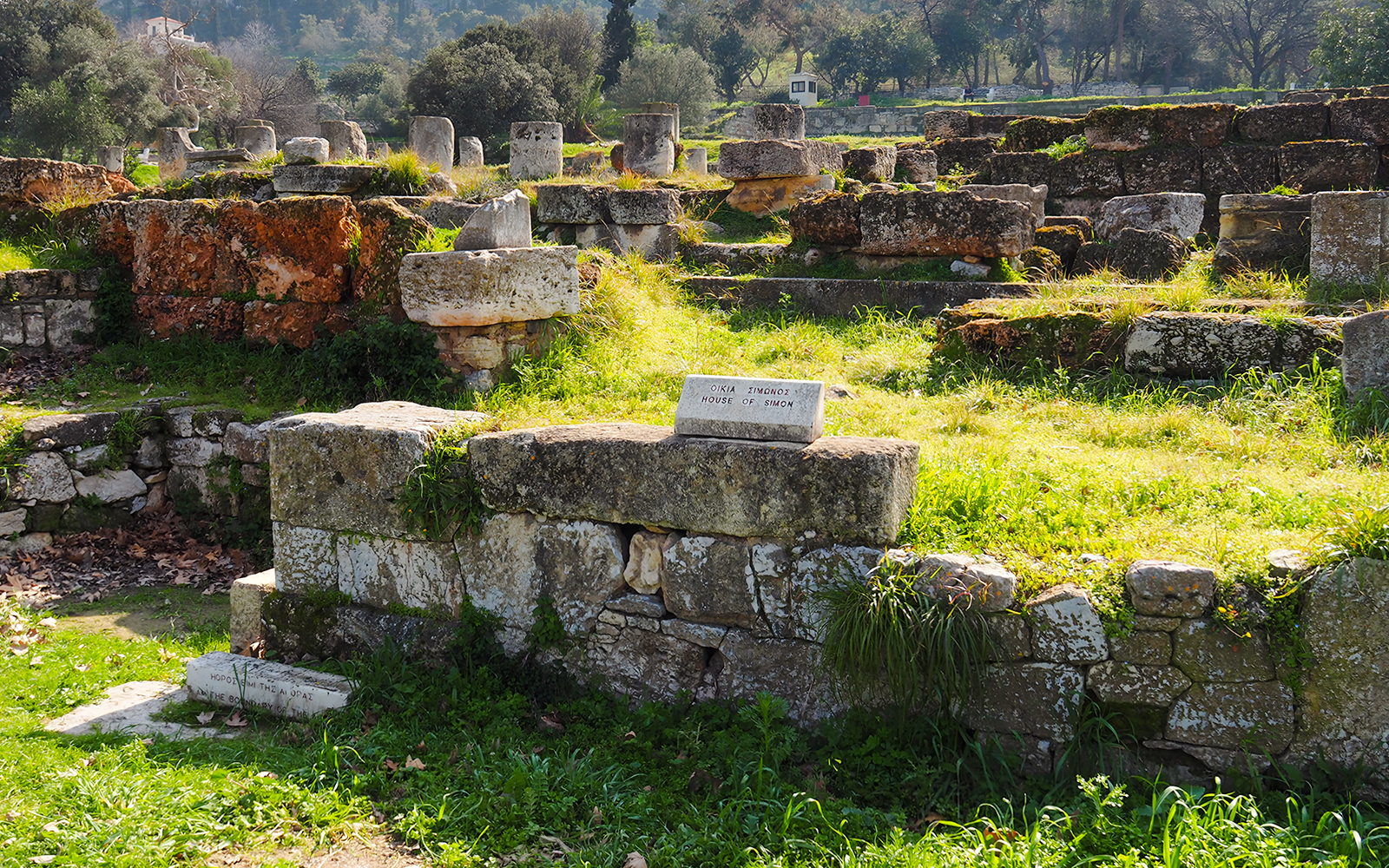 Ancient Agora ruins with "House of Simon" sign, Athens, Greece.