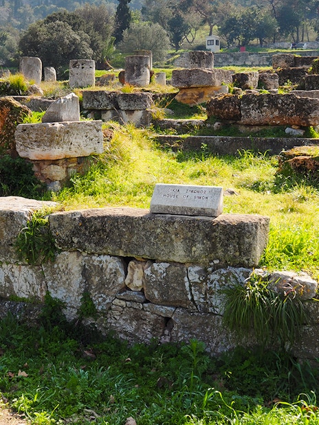 Ancient Agora ruins with "House of Simon" sign, Athens, Greece.