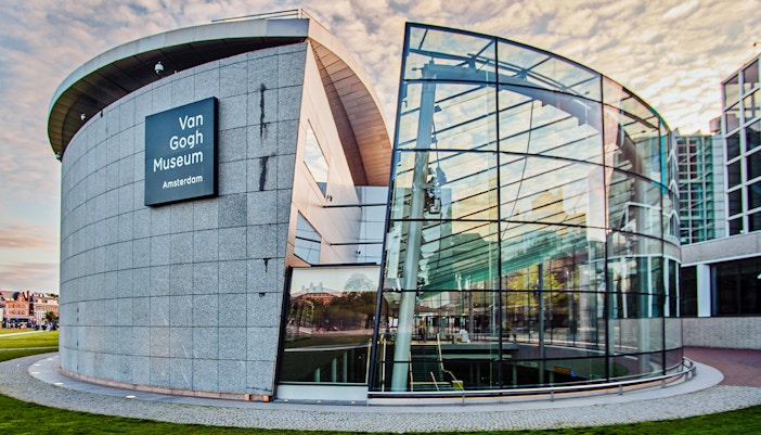 Van Gogh Museum entrance with modern glass architecture in Amsterdam.