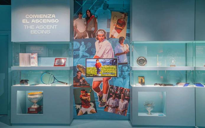 Rafa Nadal Museum exhibit featuring tennis memorabilia and photos of Nadal's career milestones.