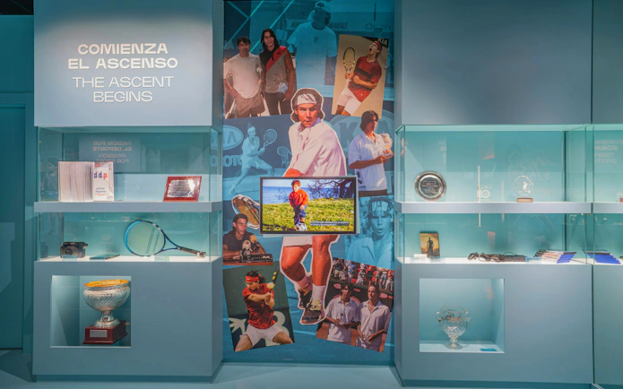 Rafa Nadal Museum exhibit featuring tennis memorabilia and photos of Nadal's career milestones.