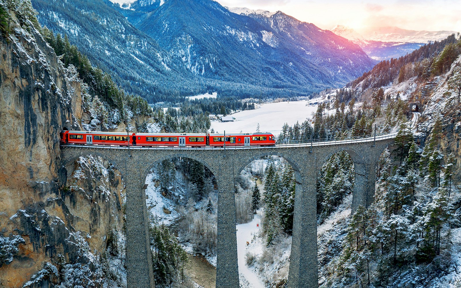 Aerial view of Train passing through Landwasser Viaduct in Filisur, Switzerland.