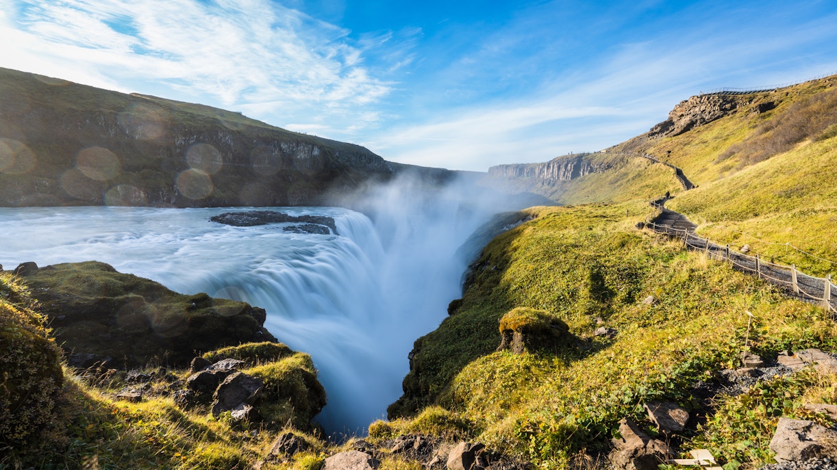 Gullfoss Falls cascading in two stages within Iceland's rugged canyon landscape.