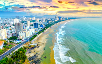Aerial view of Vũng Tàu Beach coastline with cityscape, part of a full-day tour from Ho Chi Minh City.