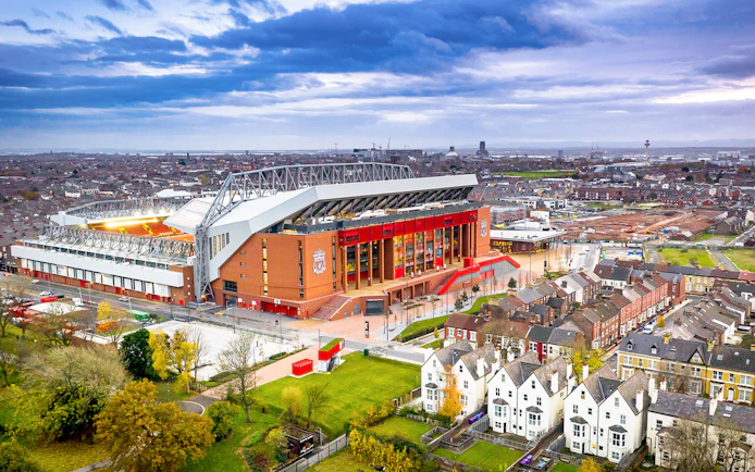 Aerial view of Anfield Stadium in Liverpool surrounded by residential area.