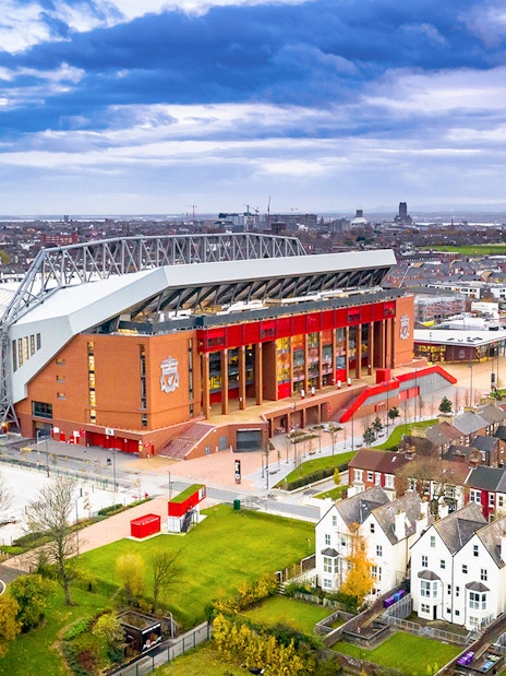 Aerial view of Anfield Stadium in Liverpool surrounded by residential area.