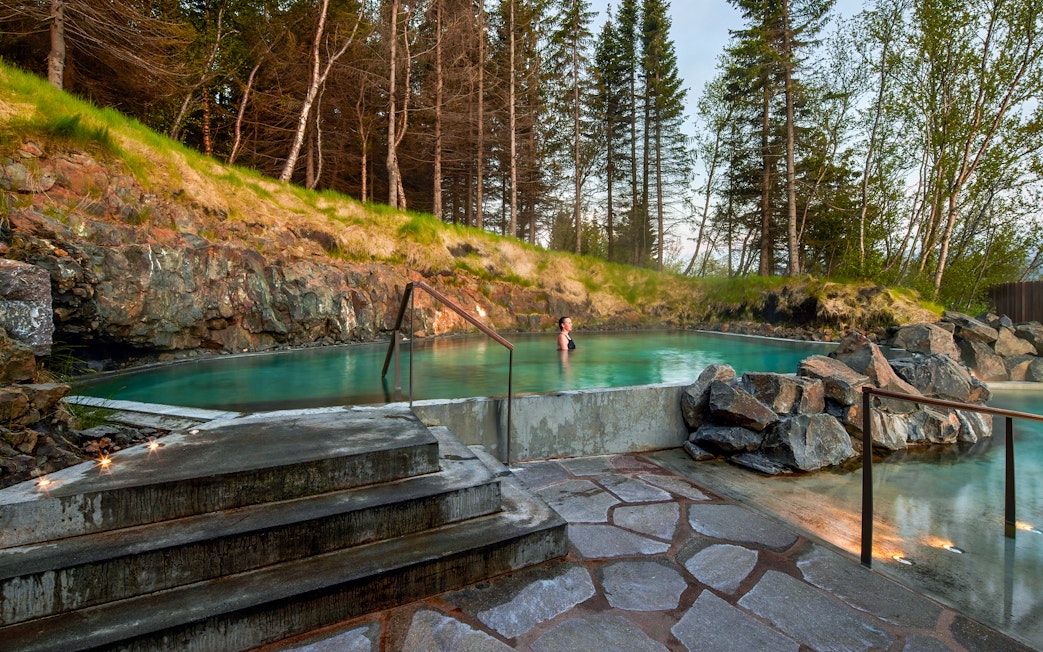 Geothermal spa in Vaðlaskógur forest near Akureyri, North Iceland.