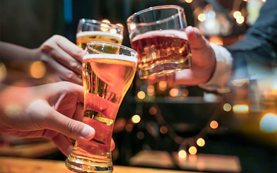 Glasses of beer and alcohol being cheered on a cruise.