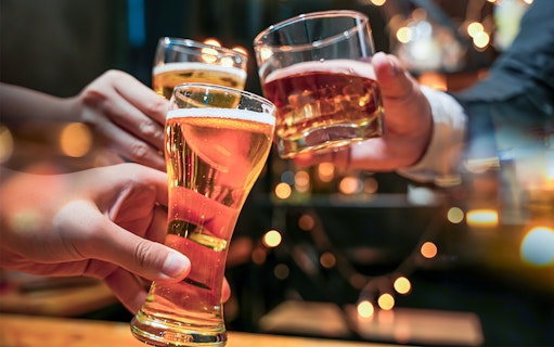 Glasses of beer and alcohol being cheered on a cruise.