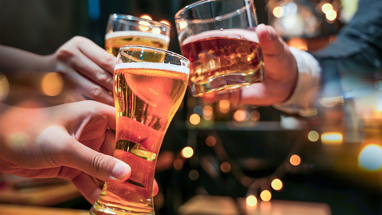 Glasses of beer and alcohol being cheered on a cruise.