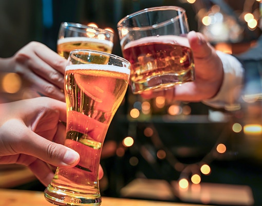 Glasses of beer and alcohol being cheered on a cruise.