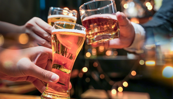 Glasses of beer and alcohol being cheered on a cruise.