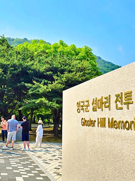 Tour group at Gloster Hill Memorial Park, Seoul to DMZ tour, South Korea.