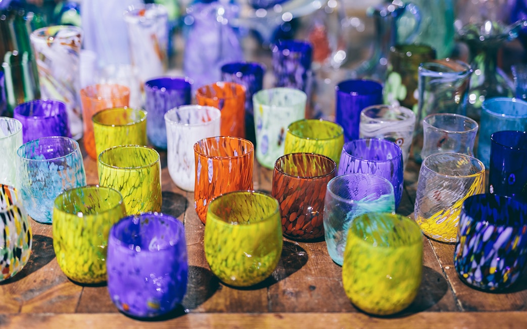 Colorful Murano glass cups displayed at Murano Glass Museum, Venice.