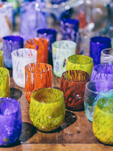 Colorful Murano glass cups displayed at Murano Glass Museum, Venice.