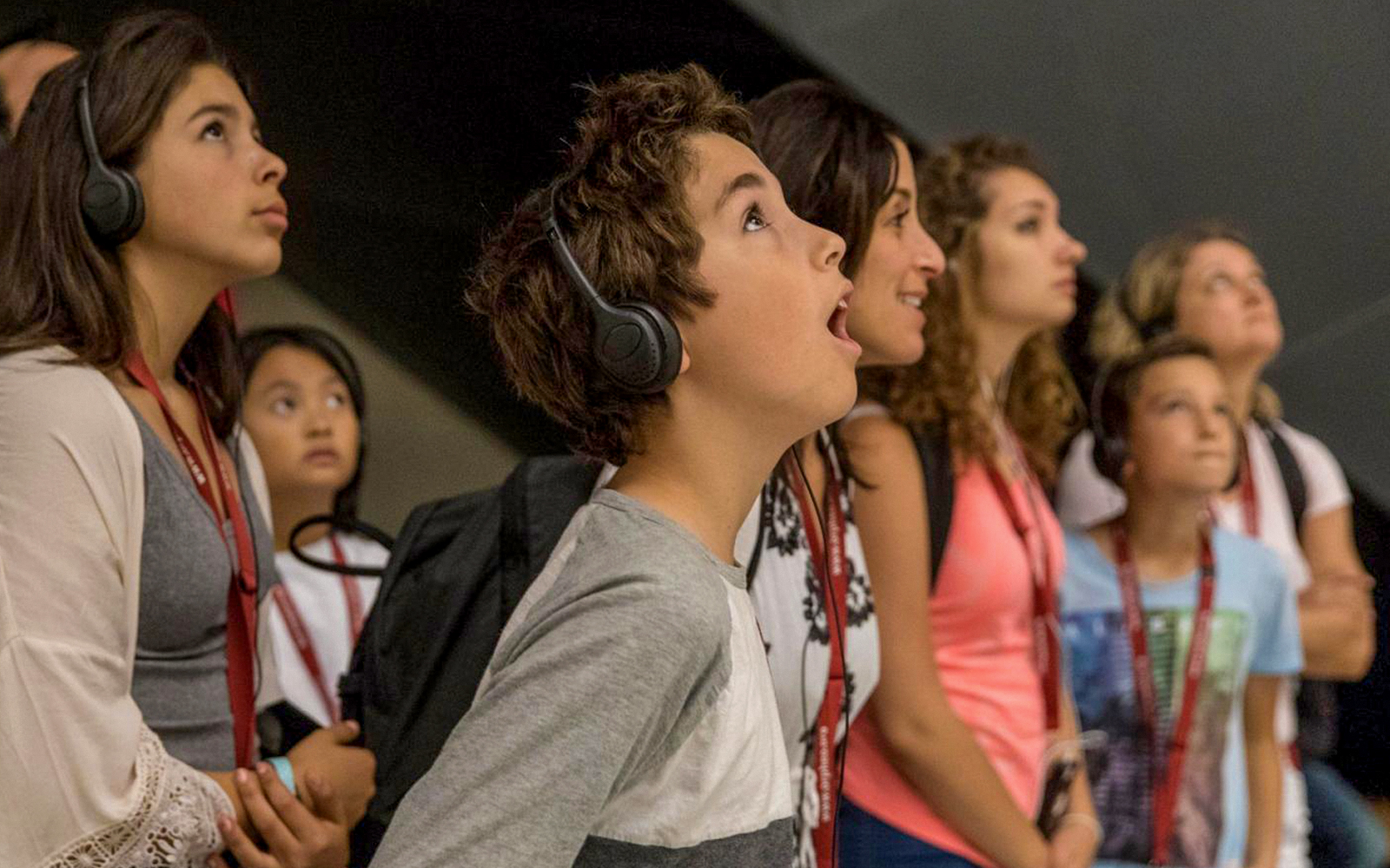 tourist using audio guide at historical site in rome italy