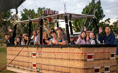 Group enjoying hot air balloon ride near Sirromet Winery, Gold Coast.