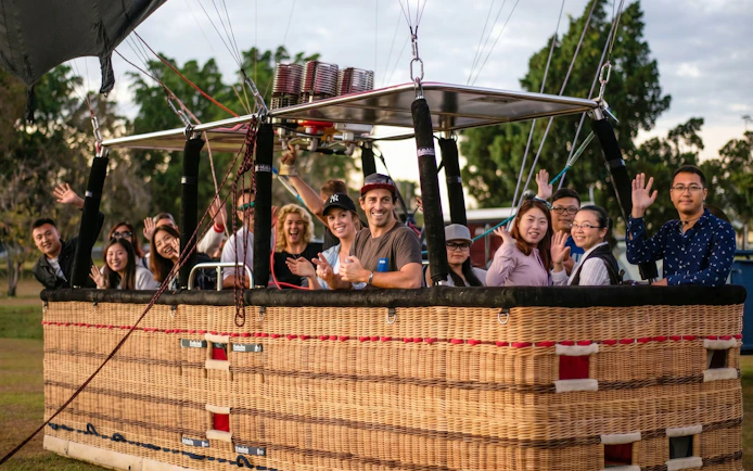 Group enjoying hot air balloon ride near Sirromet Winery, Gold Coast.