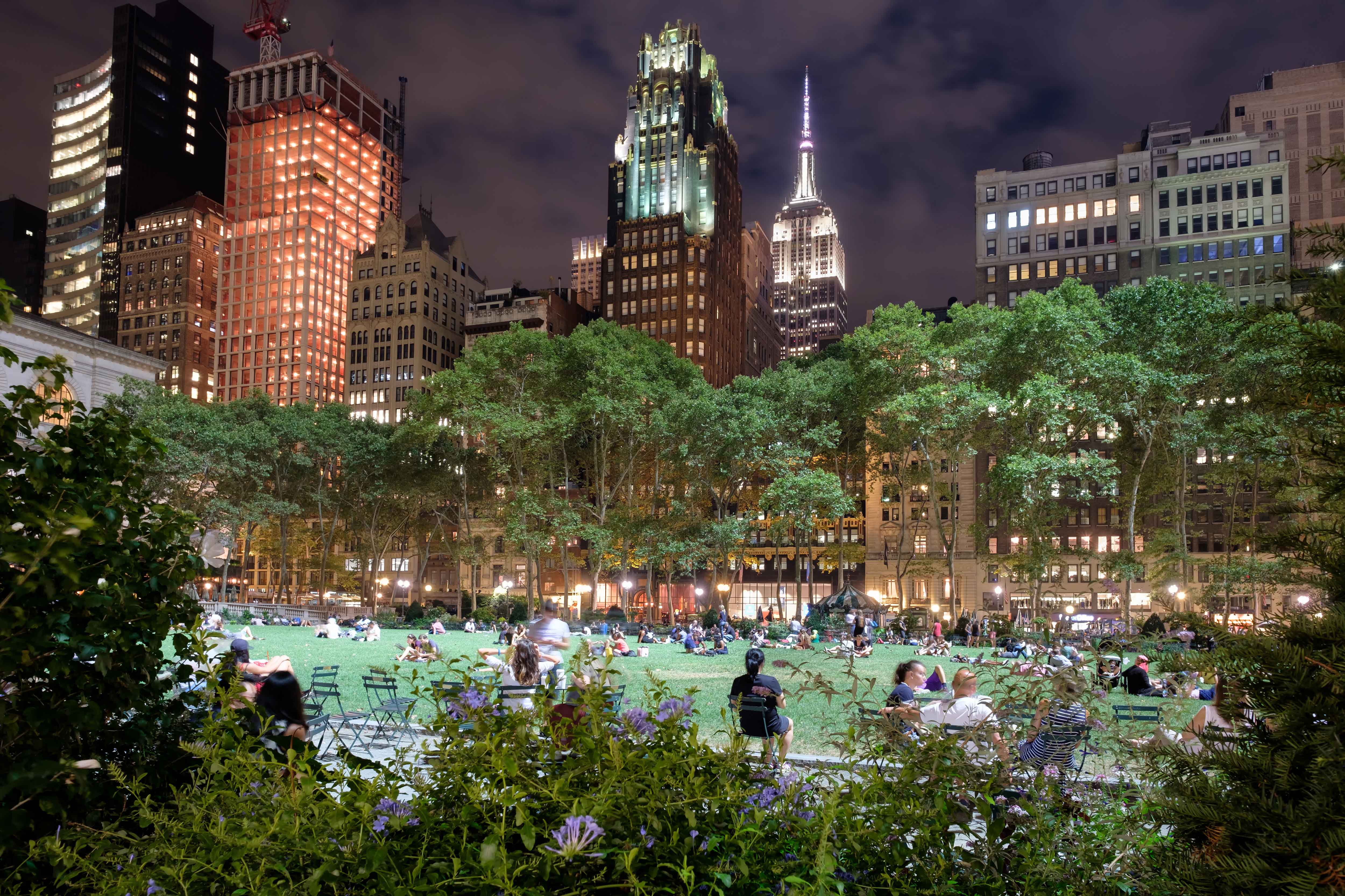 Crowd gathered on lawn at night for HBO Bryant Park Summer Film Festival, New York City.