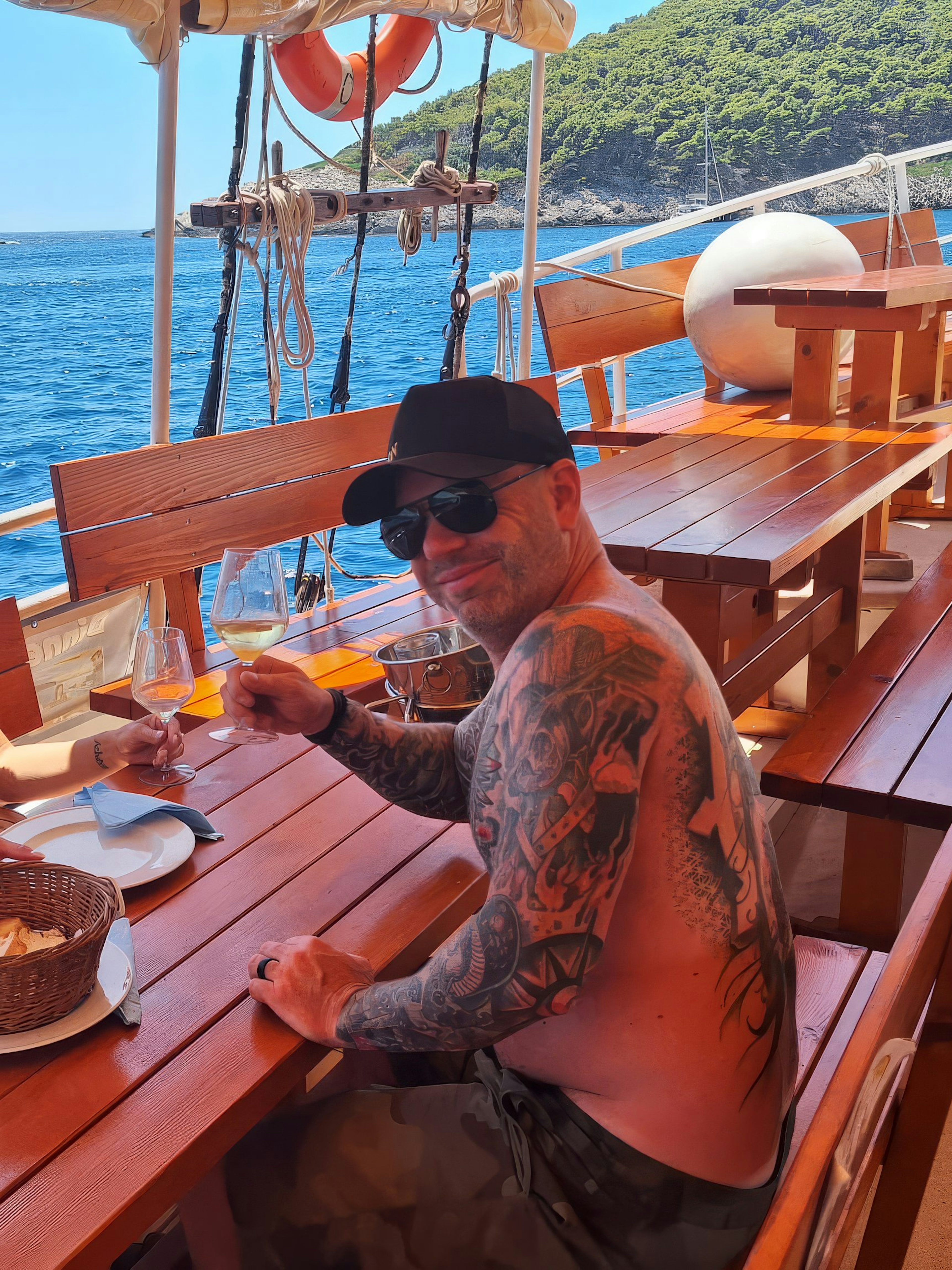 Couple having lunch on a boat with sea view in Dubrovnik.