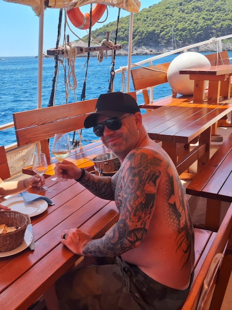 Couple having lunch on a boat with sea view in Dubrovnik.