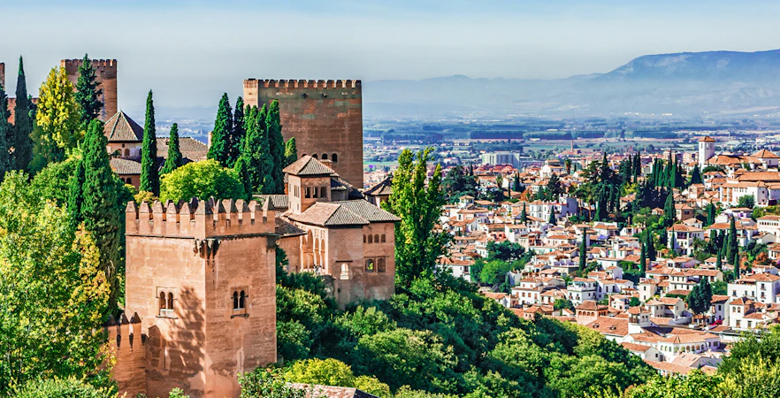 Panoramic view of Alhambra with surrounding cityscape in Granada, Spain.