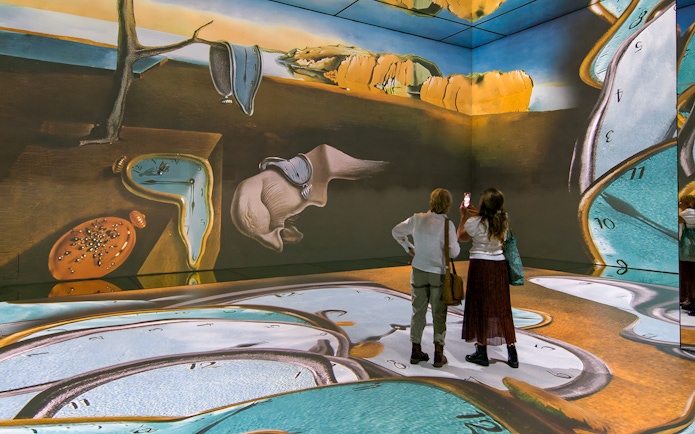 Visitors viewing surreal art installation at Beyond Reality exhibit, Frameless London.