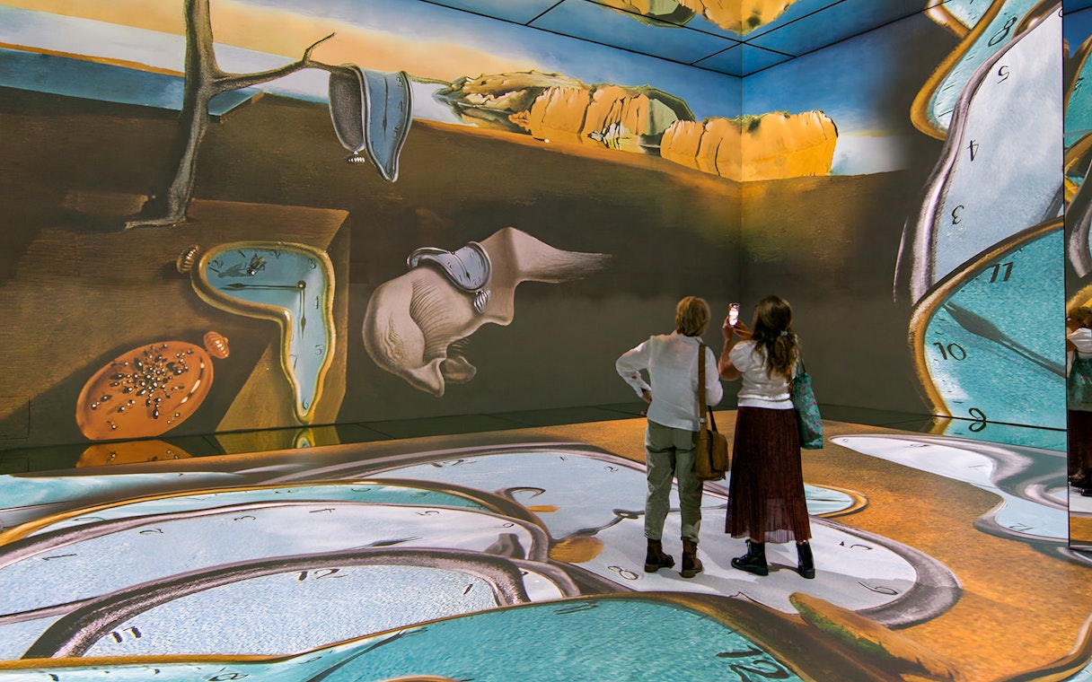 Visitors viewing surreal art installation at Beyond Reality exhibit, Frameless London.