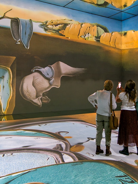 Visitors viewing surreal art installation at Beyond Reality exhibit, Frameless London.