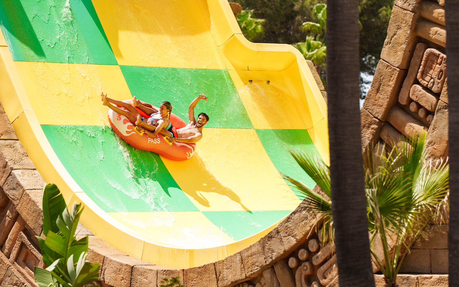 Riders enjoying the Tsunami ride at Aqualand El Arenal.