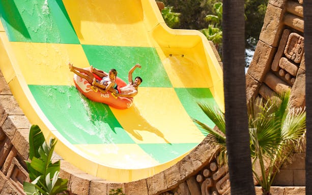 Riders enjoying the Tsunami ride at Aqualand El Arenal.