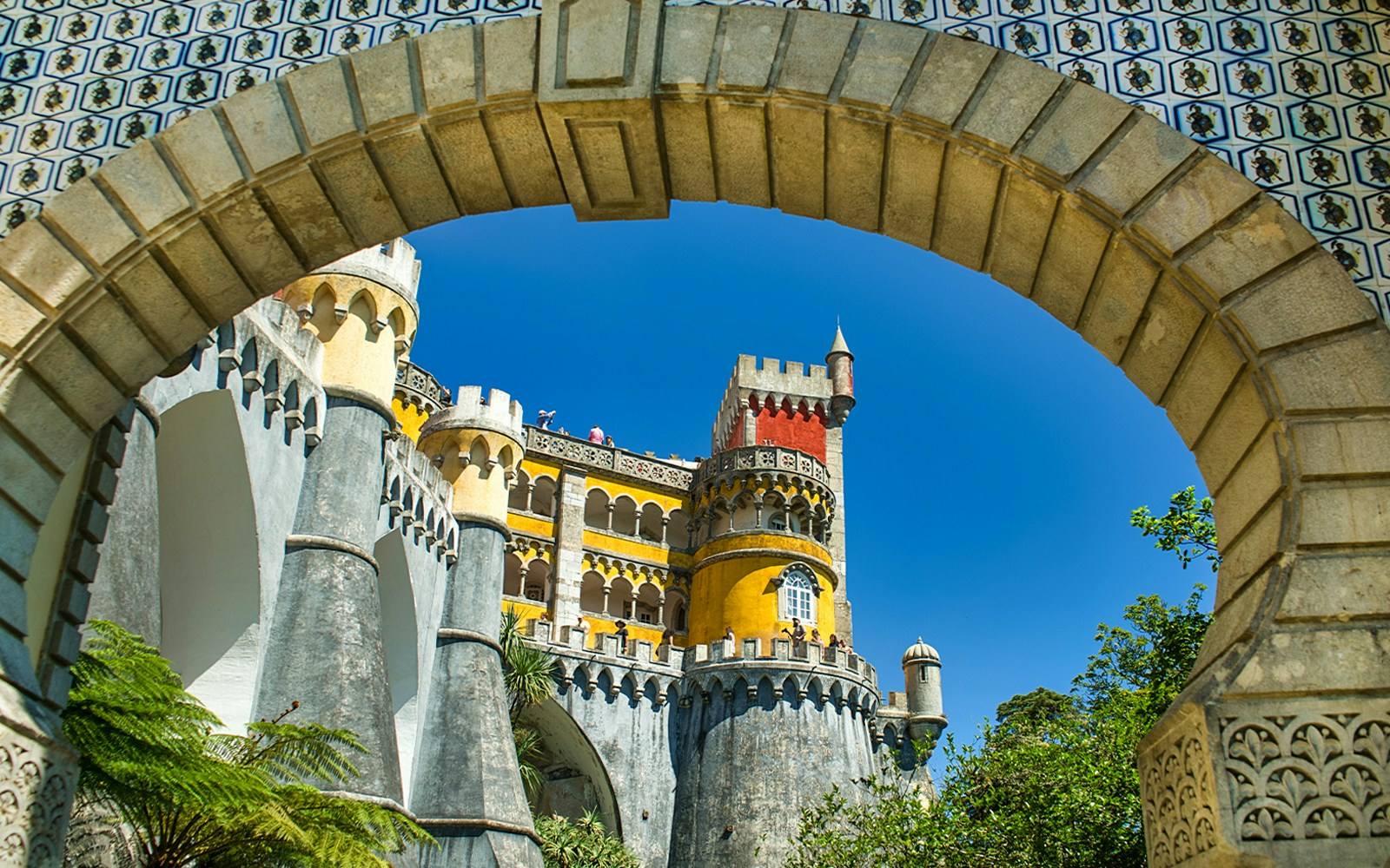 Pena Palace in Sintra with vibrant colors and unique architecture on a guided tour.