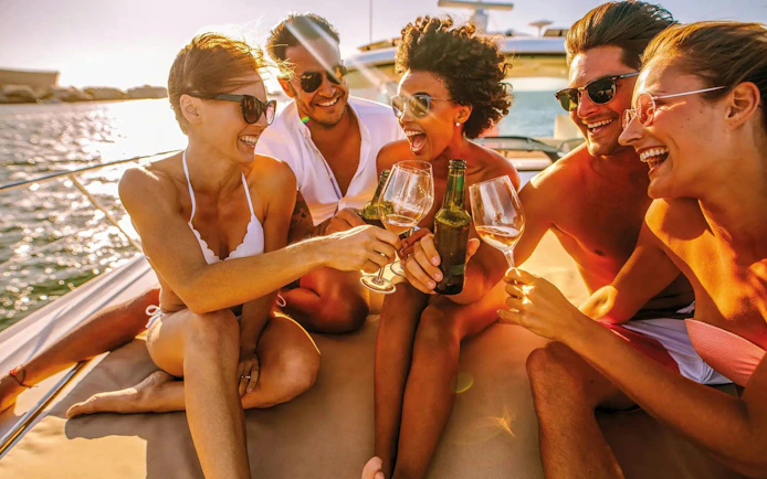 Group enjoying drinks on a boat during Algarve sunset experience.