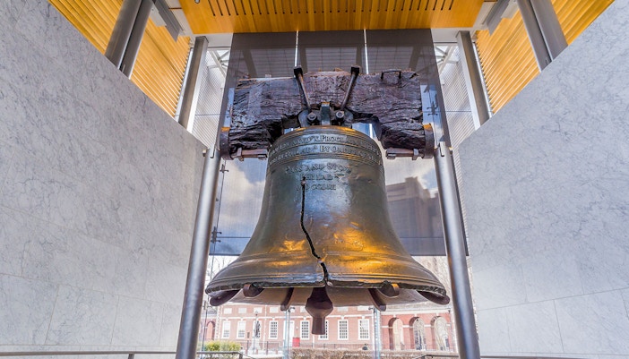 Liberty Bell with visible crack in Philadelphia museum display.