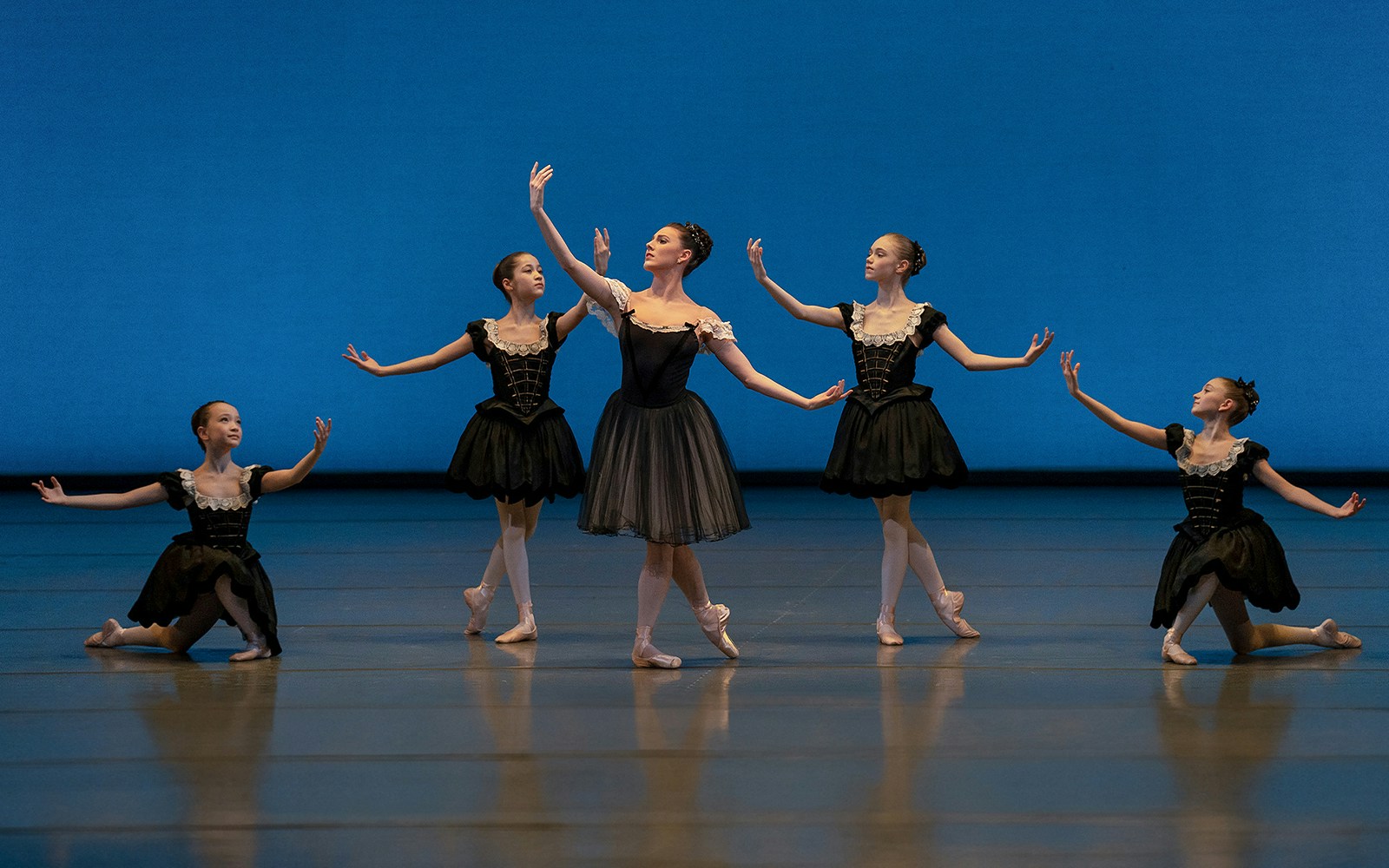Ballet dancers performing on stage at New York City Ballet.