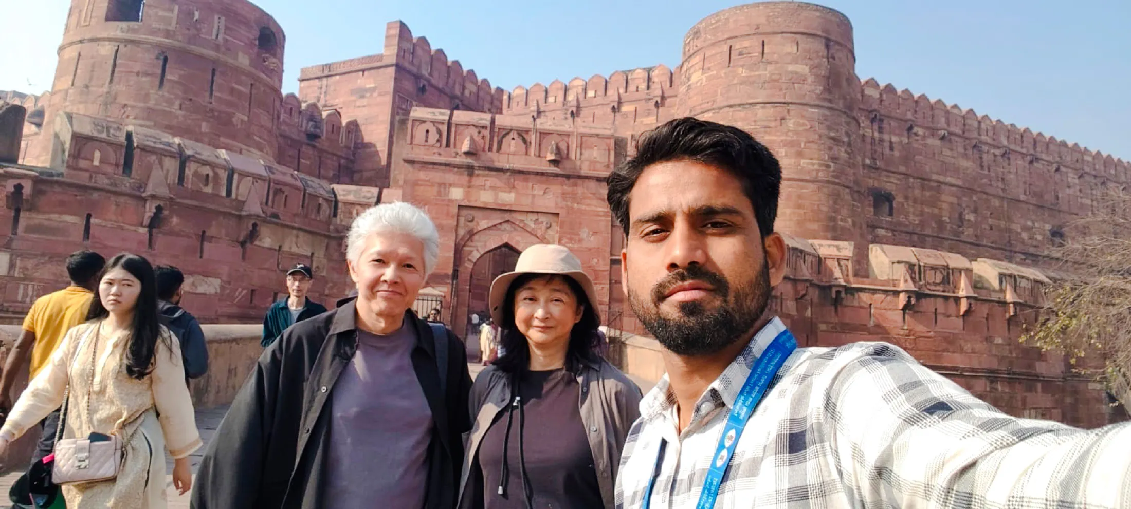 Visitors at Agra Fort during the Taj Mahal and Agra tour from Delhi.