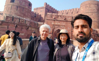 Visitors at Agra Fort during the Taj Mahal and Agra tour from Delhi.