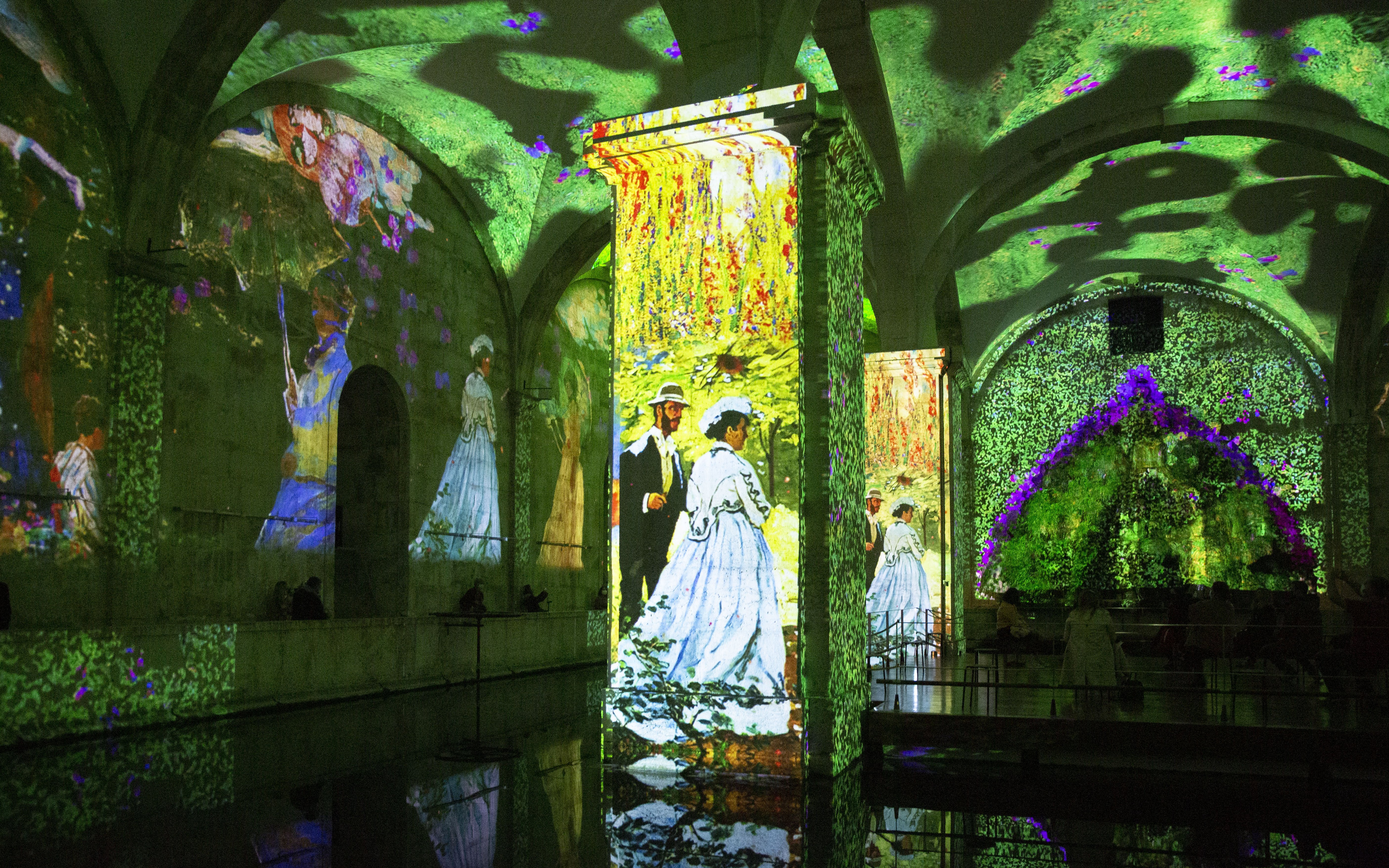 Visitors at Immersivus Gallery Lisbon viewing Monet and Klimt light and sound show.