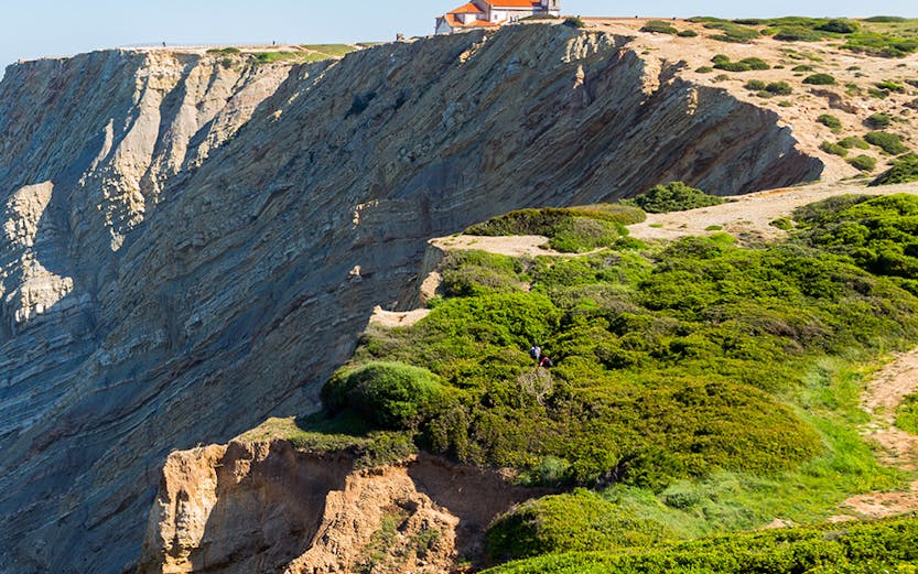 Cliffside view with a chapel at Arrabida Natural Park, Portugal.