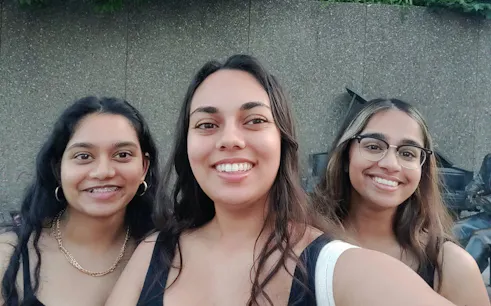 Three people smiling during the Ottawa Foods of the World city exploration game.